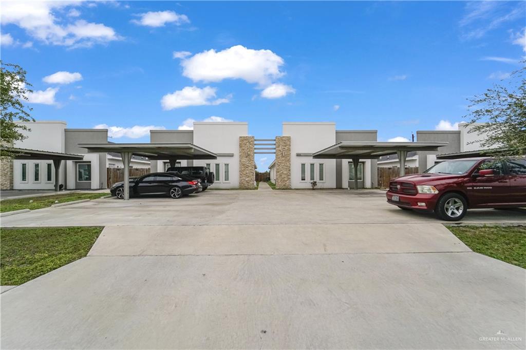 405 Rafael Drive San Juan, TX 78589 - Photo 1 of 13 a view of a car parked in front of a building