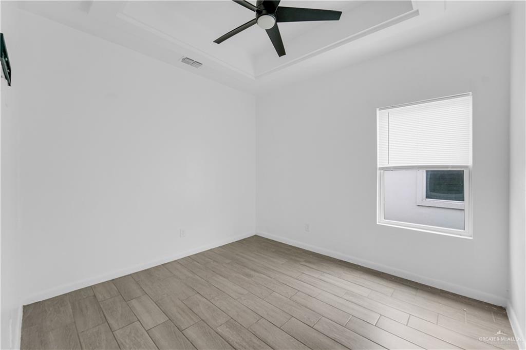 405 Rafael Drive San Juan, TX 78589 - Photo 12 of 13 wooden floor in an empty room
