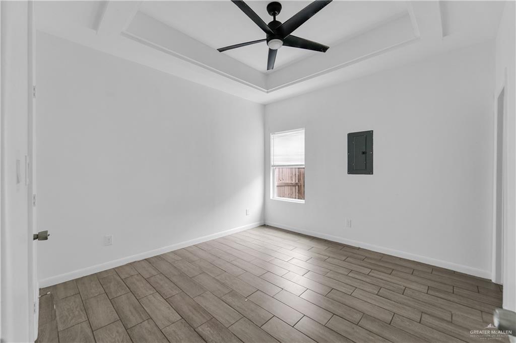 405 Rafael Drive San Juan, TX 78589 - Photo 13 of 13 a view of a livingroom with wooden floor and a window