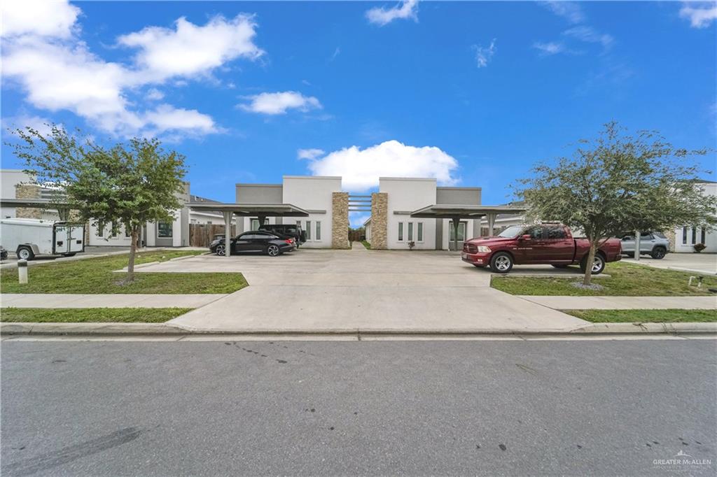 405 Rafael Drive San Juan, TX 78589 - Photo 2 of 13 a view of a street with a cars parked in front of it