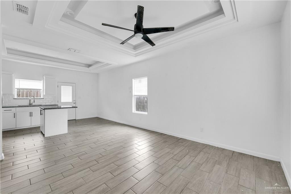 405 Rafael Drive San Juan, TX 78589 - Photo 6 of 13 a view of empty room with wooden floor and fan