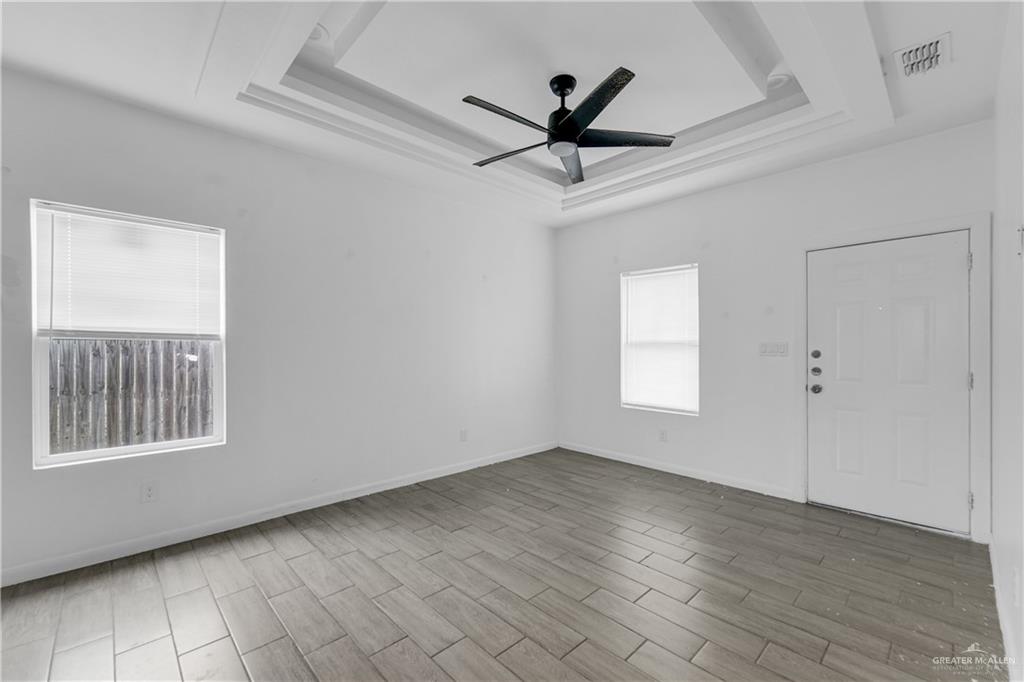 405 Rafael Drive San Juan, TX 78589 - Photo 9 of 13 a view of a livingroom with a ceiling fan and window