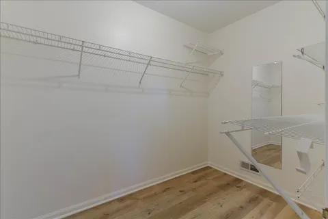 a view of a room with racks on the wall