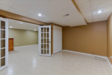 an empty room with furniture and entrance