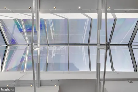 a bathroom with a shower and a mirror