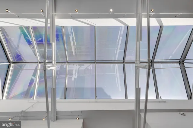 a bathroom with a shower and a mirror