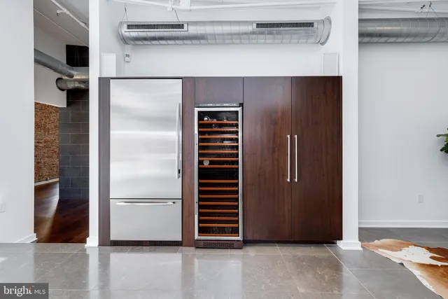 a view of walk in closet with clothes