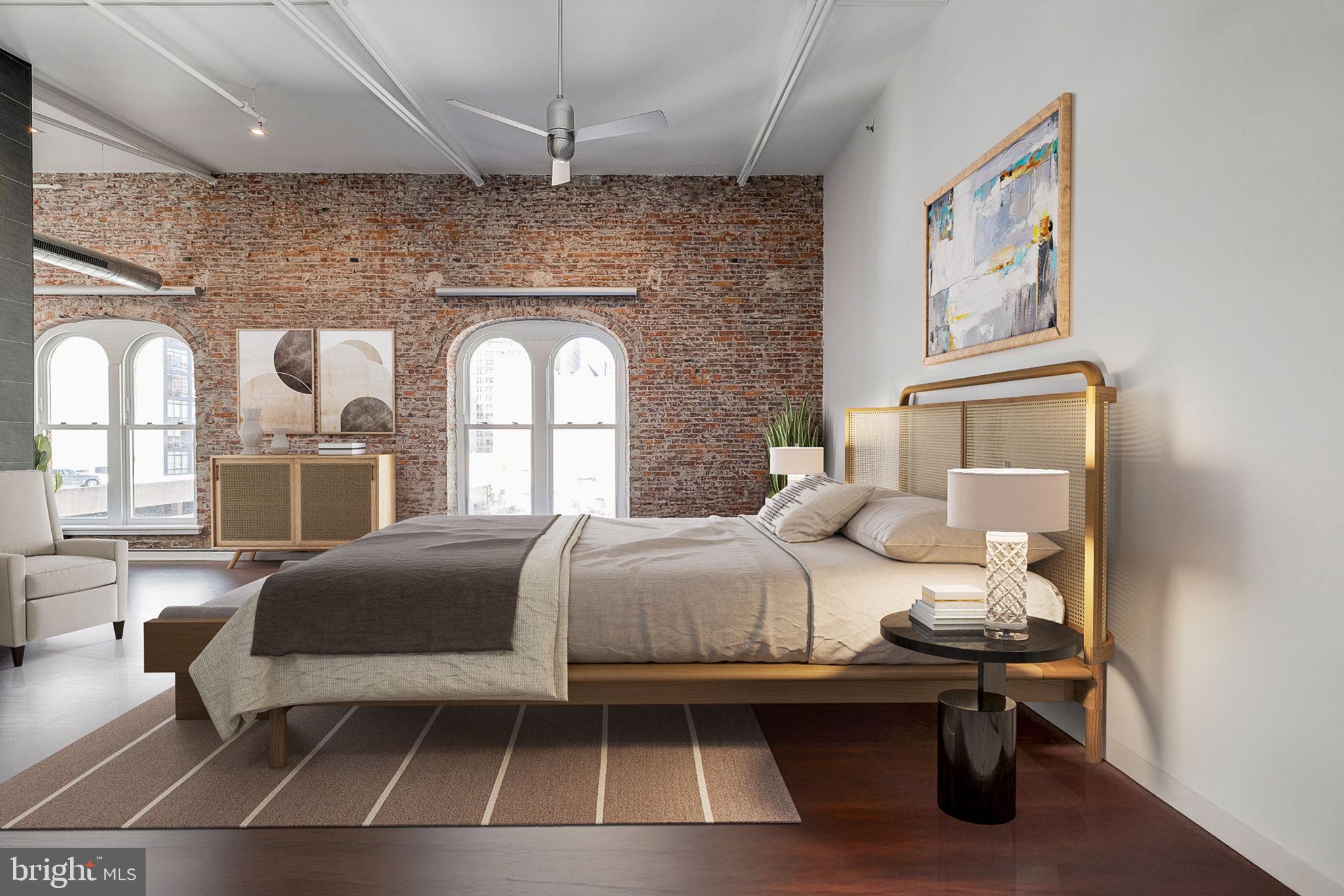 105-32 South 12th Street, Unit PH504 Philadelphia, PA 19107 - Photo 21 of 45 a bedroom with a bed and a large window