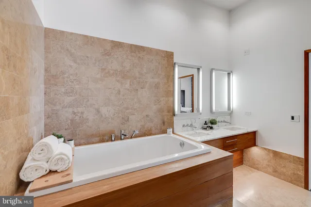 a bathroom with a bathtub and a sink
