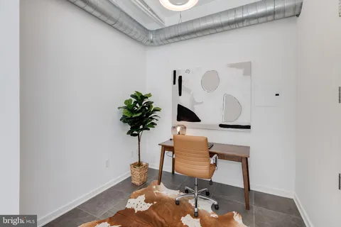 a view of a workspace with furniture