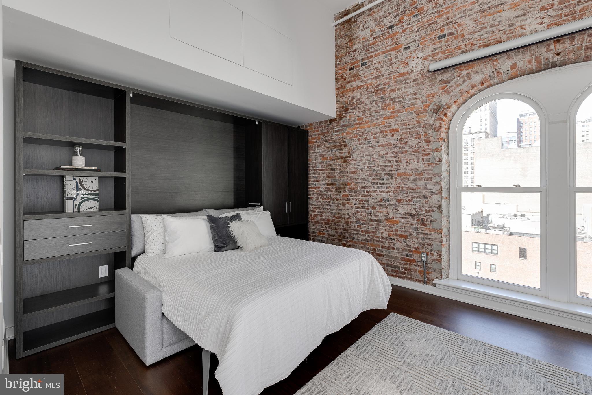 105-32 South 12th Street, Unit PH504 Philadelphia, PA 19107 - Photo 34 of 45 a bedroom with a bed and a window