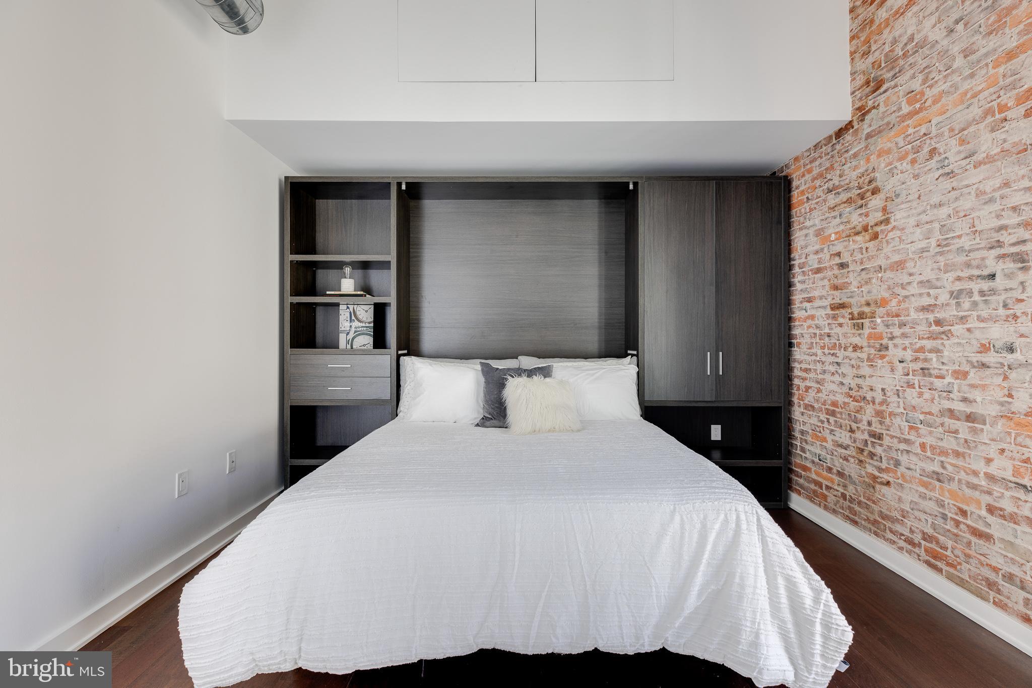 105-32 South 12th Street, Unit PH504 Philadelphia, PA 19107 - Photo 36 of 45 a bedroom with a bed and a night stand