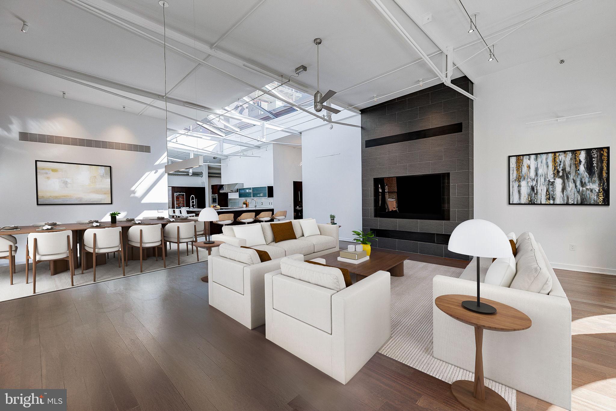 105-32 South 12th Street, Unit PH504 Philadelphia, PA 19107 - Photo 4 of 45 a living room with furniture and a flat screen tv