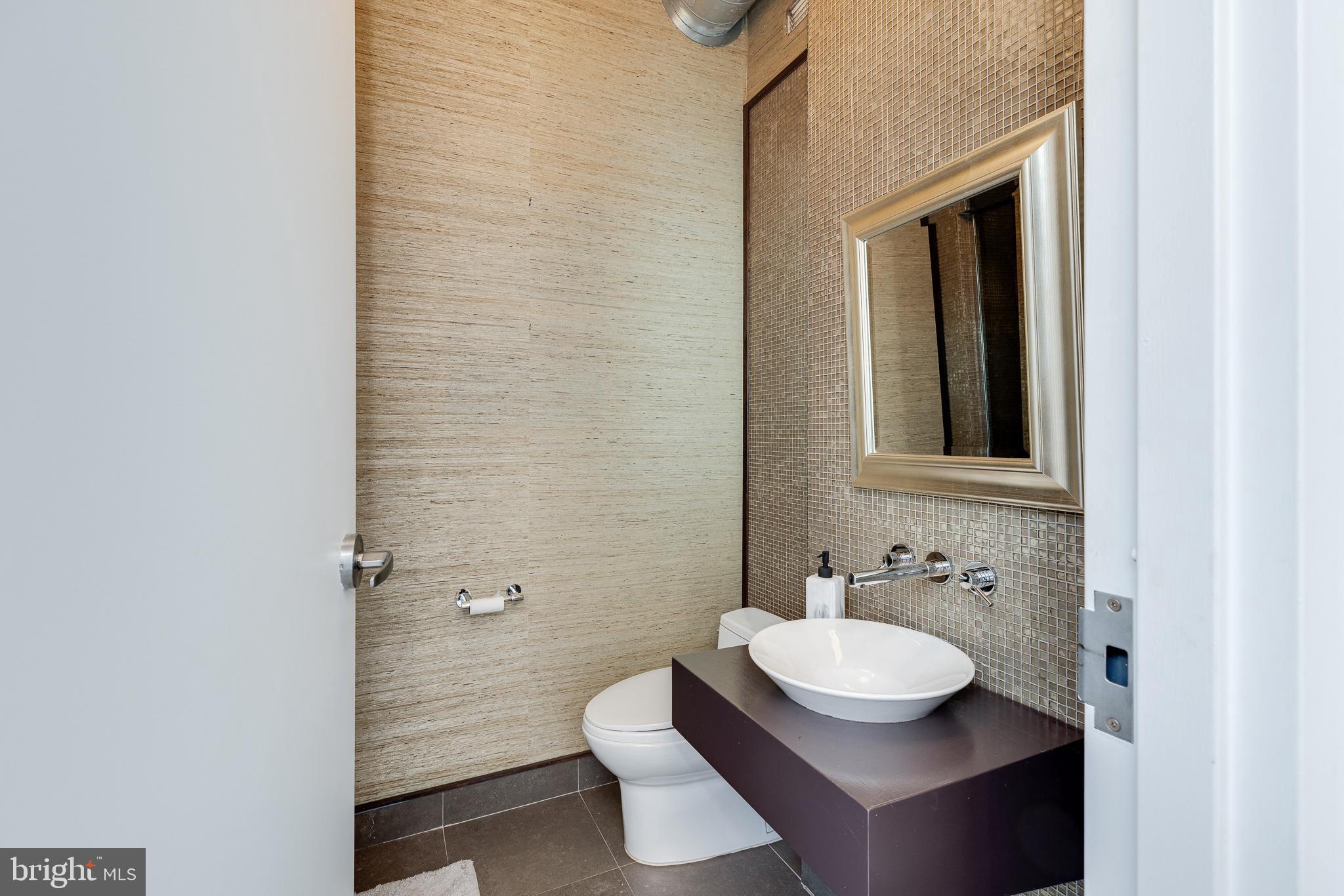 105-32 South 12th Street, Unit PH504 Philadelphia, PA 19107 - Photo 42 of 45 a bathroom with a sink and a mirror