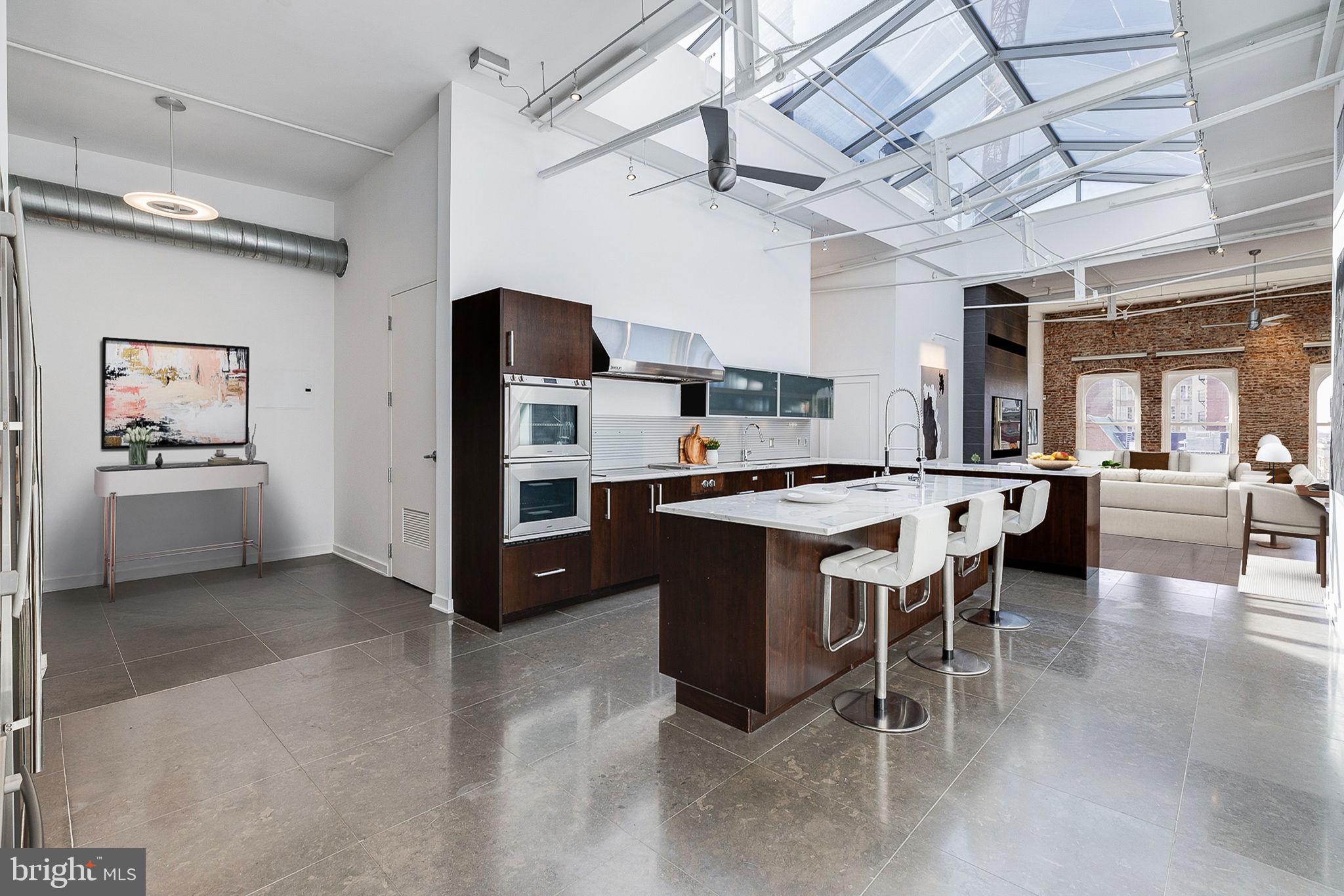 105-32 South 12th Street, Unit PH504 Philadelphia, PA 19107 - Photo 7 of 45 a kitchen with a sink cabinets and window