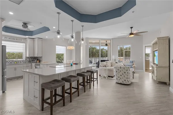 a large kitchen with a table and chairs