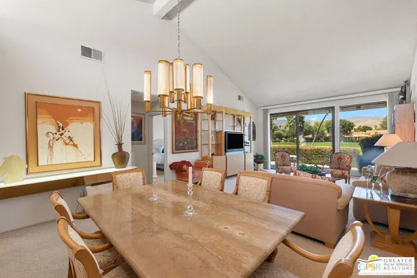 a kitchen with granite countertop white cabinets white appliances with a sink and dishwasher