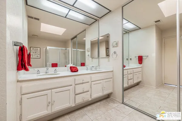 a bathroom with a shower and a sink