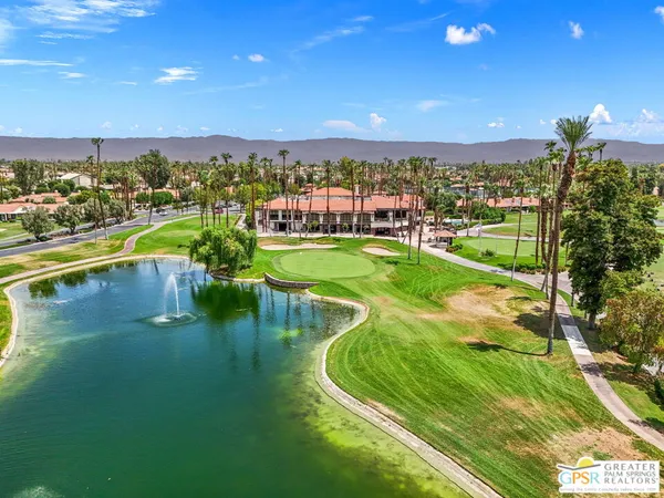 a view of a golf course with a lake view