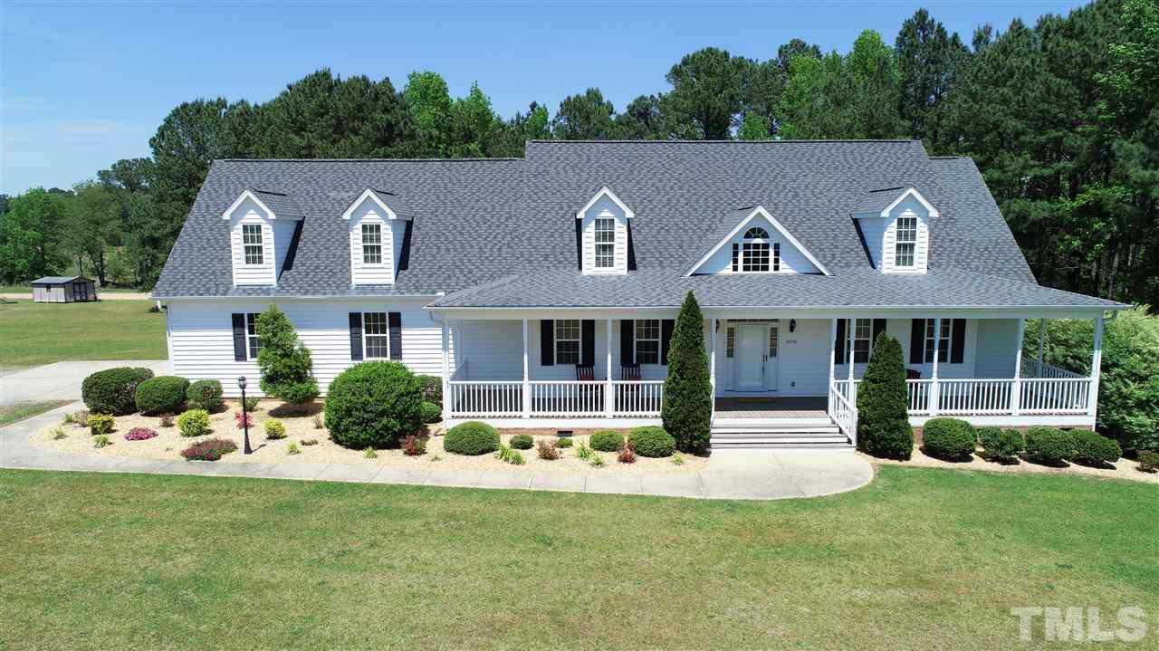 5976 Elevation Road Benson, NC 27504 - Photo 1 of 25 a front view of a house with a yard