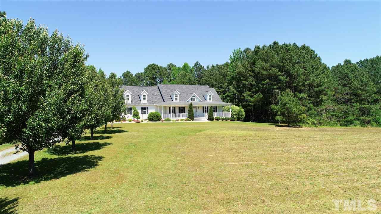 5976 Elevation Road Benson, NC 27504 - Photo 2 of 25 a swimming pool view with a garden