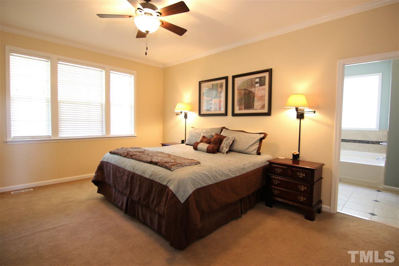 5976 Elevation Road Benson, NC 27504 - Photo 12 of 25 a bedroom with a bed and window