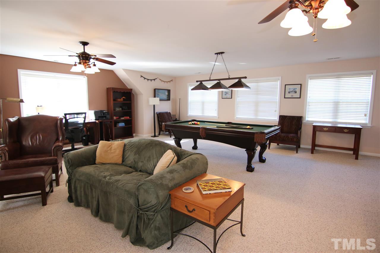 5976 Elevation Road Benson, NC 27504 - Photo 19 of 25 a living room with furniture piano and a window