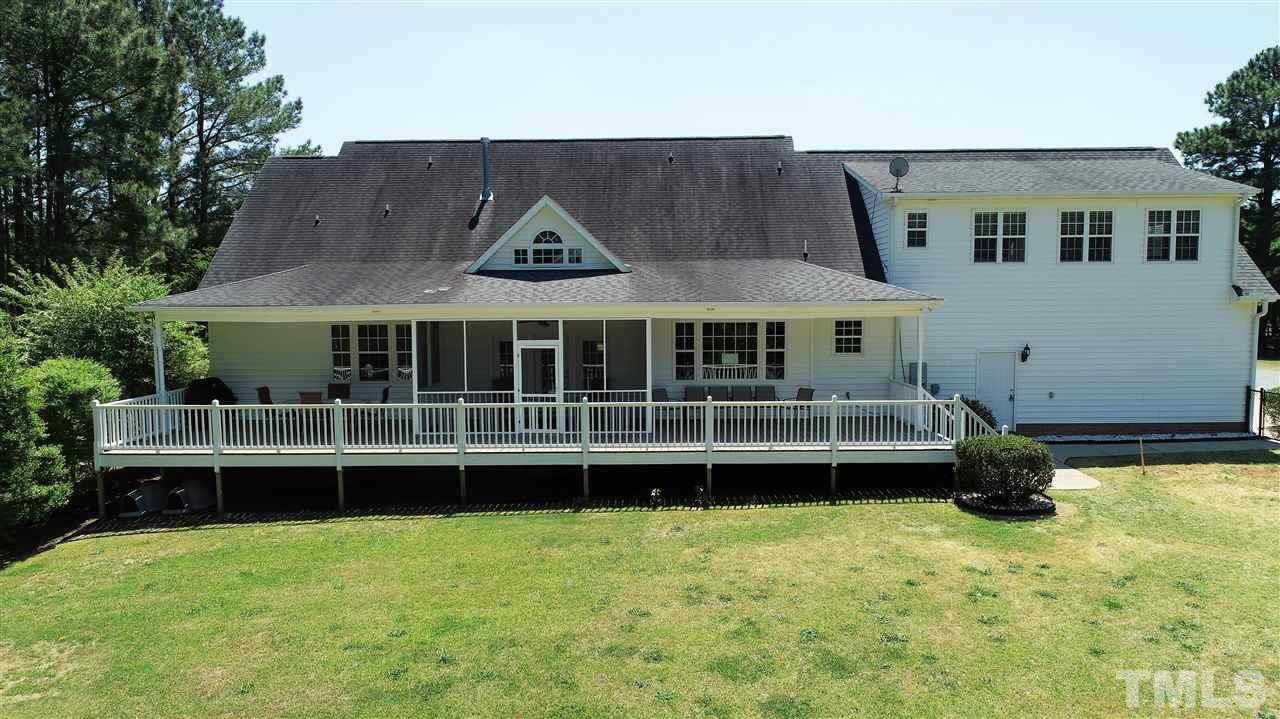 5976 Elevation Road Benson, NC 27504 - Photo 23 of 25 a front view of a house with a garden