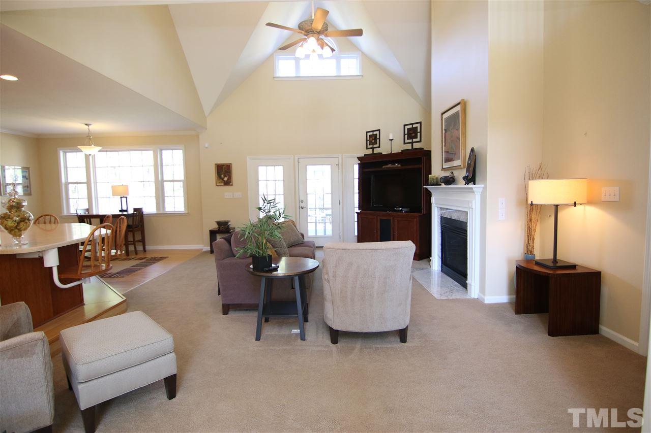 5976 Elevation Road Benson, NC 27504 - Photo 4 of 25 a living room with furniture and a chandelier