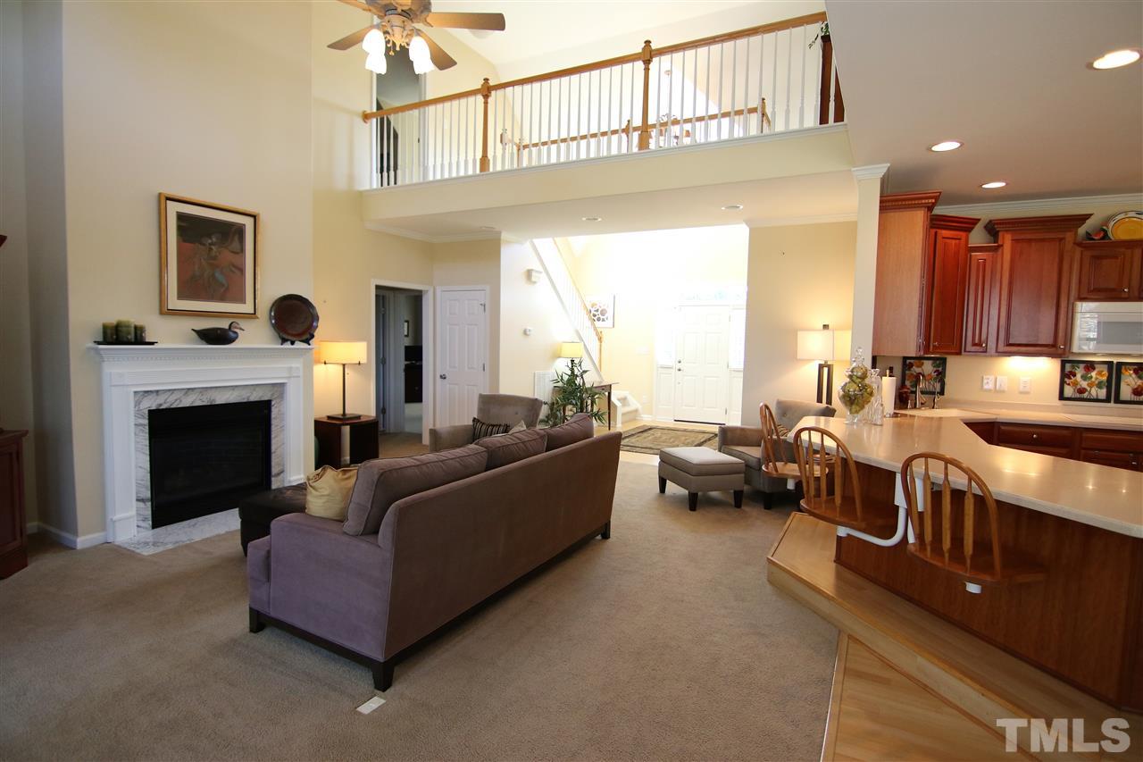 5976 Elevation Road Benson, NC 27504 - Photo 6 of 25 a living room with furniture and a fireplace