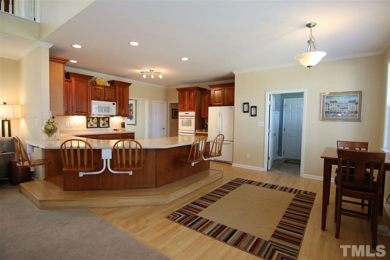 5976 Elevation Road Benson, NC 27504 - Photo 8 of 25 a large kitchen with a table and chairs