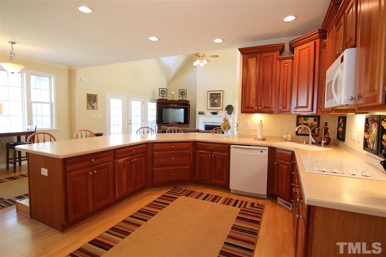 5976 Elevation Road Benson, NC 27504 - Photo 9 of 25 a kitchen with stainless steel appliances granite countertop a sink and cabinets