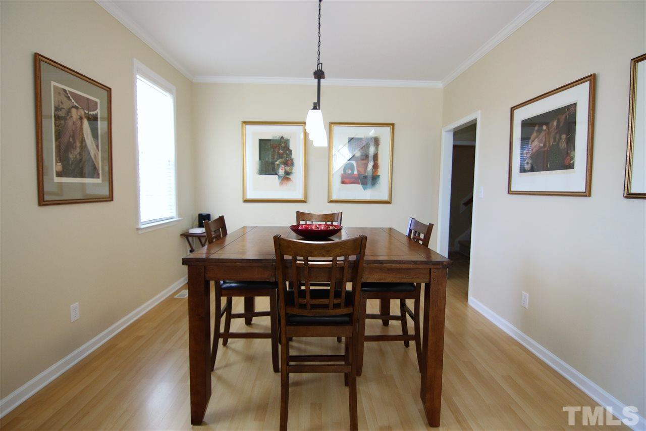 5976 Elevation Road Benson, NC 27504 - Photo 10 of 25 a view of a dining room with furniture window and wooden floor