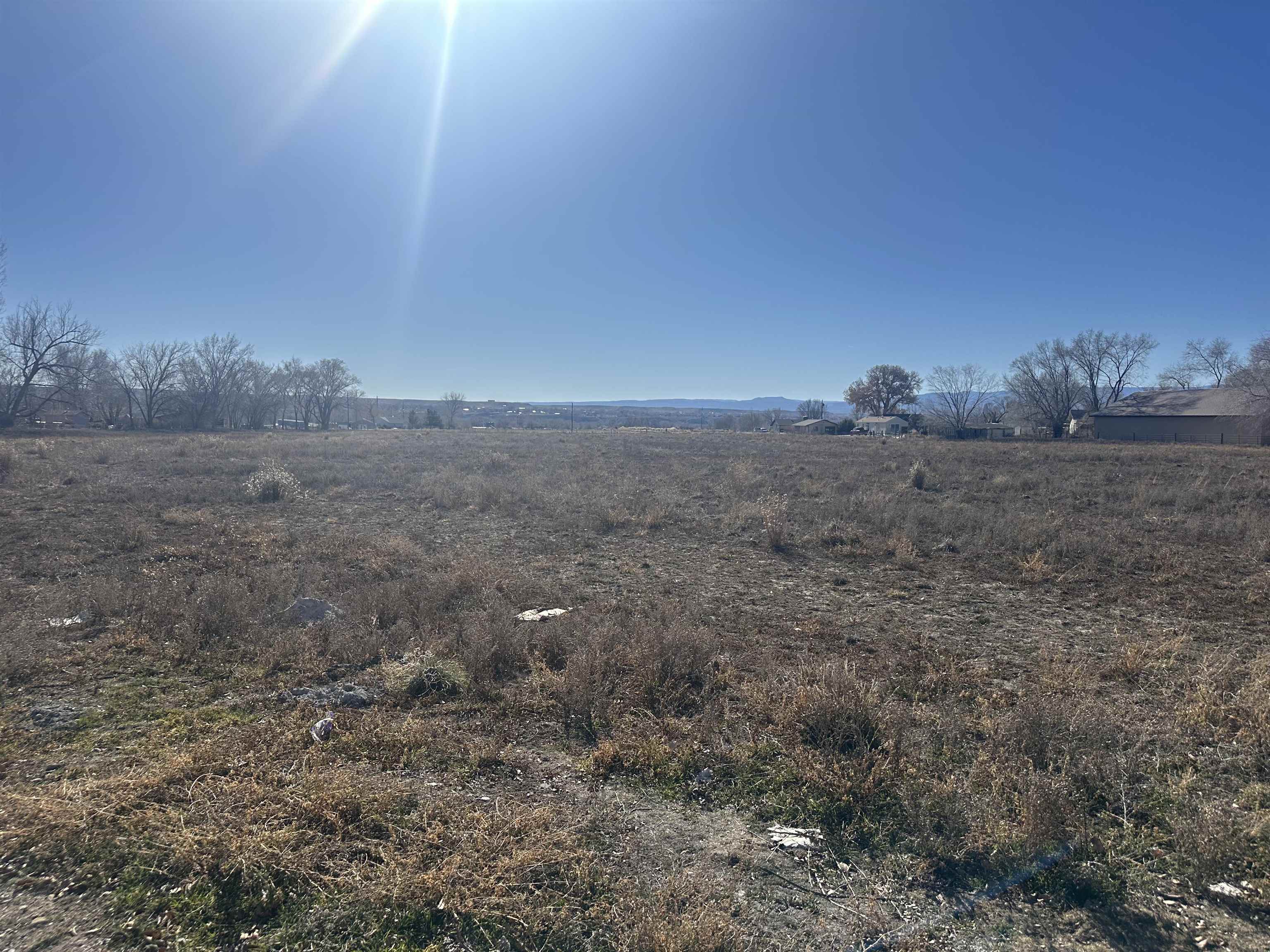 3349 East 3/4 Road Clifton, CO 81520 - Photo 1 of 1 a view of a dry yard with wooden fence