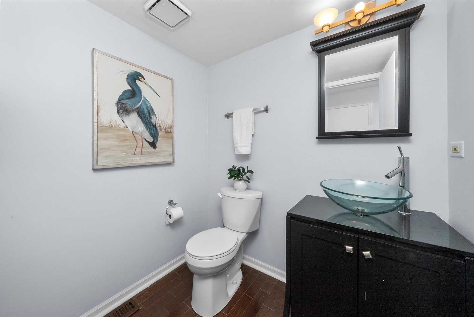 167 Forestview Court Aurora, IL 60502 - Photo 15 of 48 a bathroom with a toilet a sink and mirror