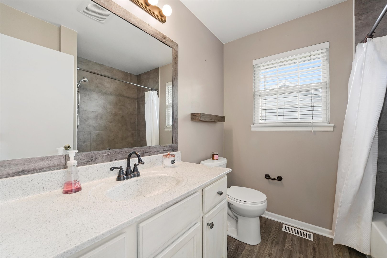 167 Forestview Court Aurora, IL 60502 - Photo 27 of 48 a bathroom with a sink toilet and a mirror