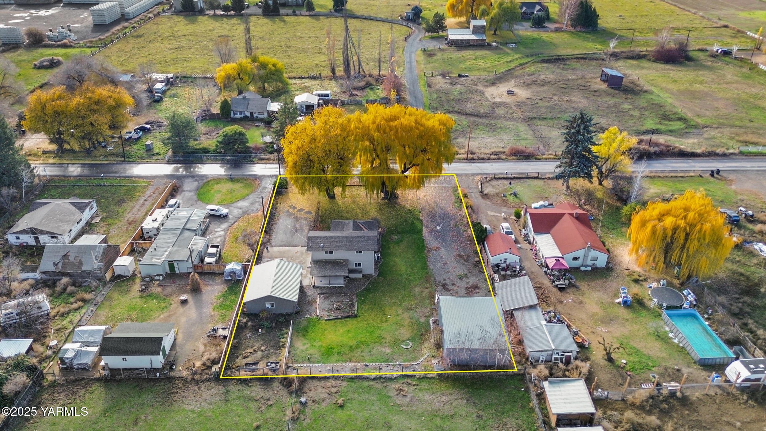 an aerial view of residential houses with outdoor space