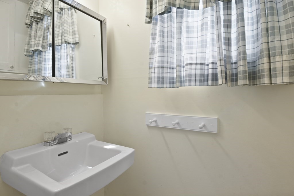 22 Kendall Road Lexington, MA 02421 - Photo 14 of 24 a bathroom with a sink and a mirror
