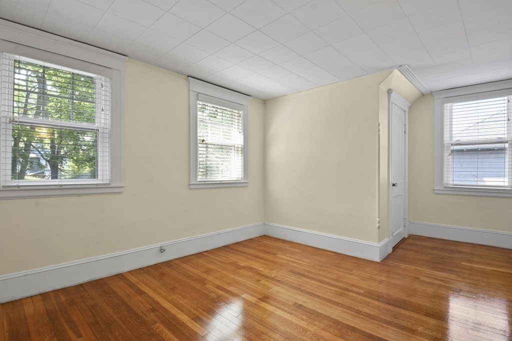 22 Kendall Road Lexington, MA 02421 - Photo 17 of 24 a view of empty room with wooden floor and fan
