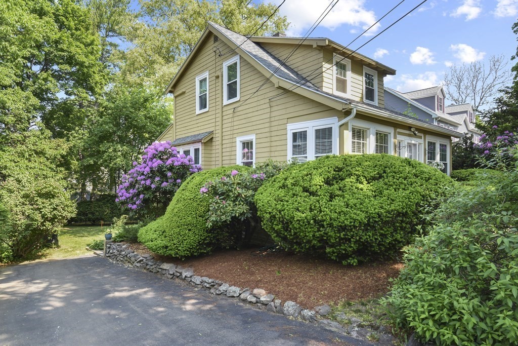 22 Kendall Road Lexington, MA 02421 - Photo 2 of 24 a front view of a house with a yard and trees