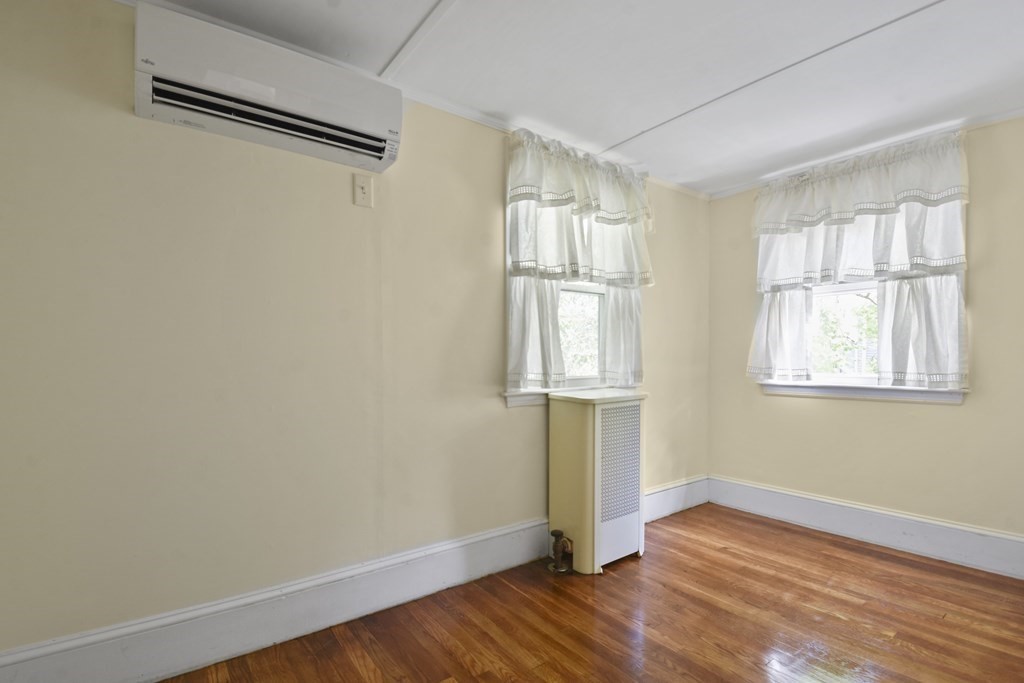 22 Kendall Road Lexington, MA 02421 - Photo 21 of 24 a view of empty room with wooden floor and fan