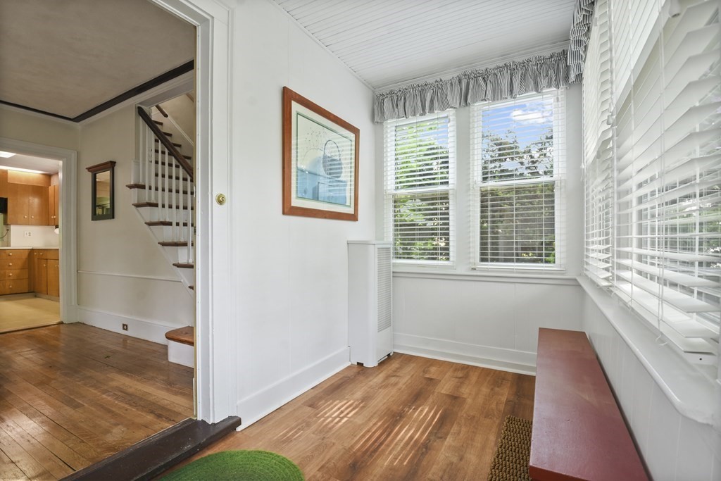 22 Kendall Road Lexington, MA 02421 - Photo 3 of 24 a view of an empty room with a window and wooden floor