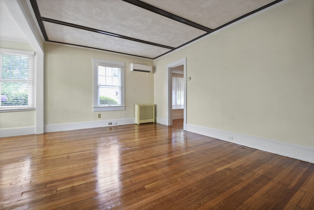 22 Kendall Road Lexington, MA 02421 - Photo 4 of 24 a view of an empty room with wooden floor and a window