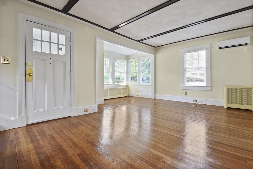 22 Kendall Road Lexington, MA 02421 - Photo 5 of 24 an empty room with wooden floor and windows