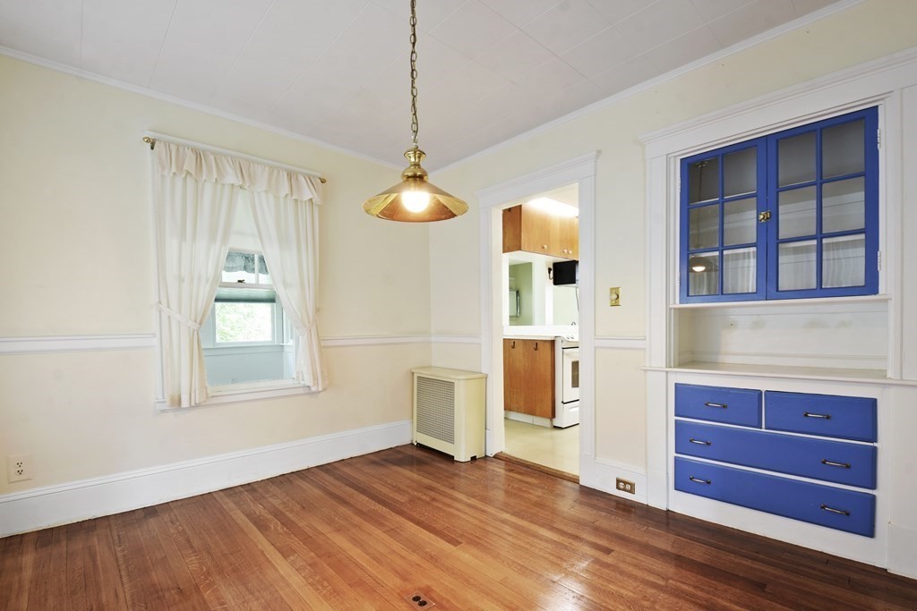 22 Kendall Road Lexington, MA 02421 - Photo 7 of 24 a view of an empty room with window and wooden floor