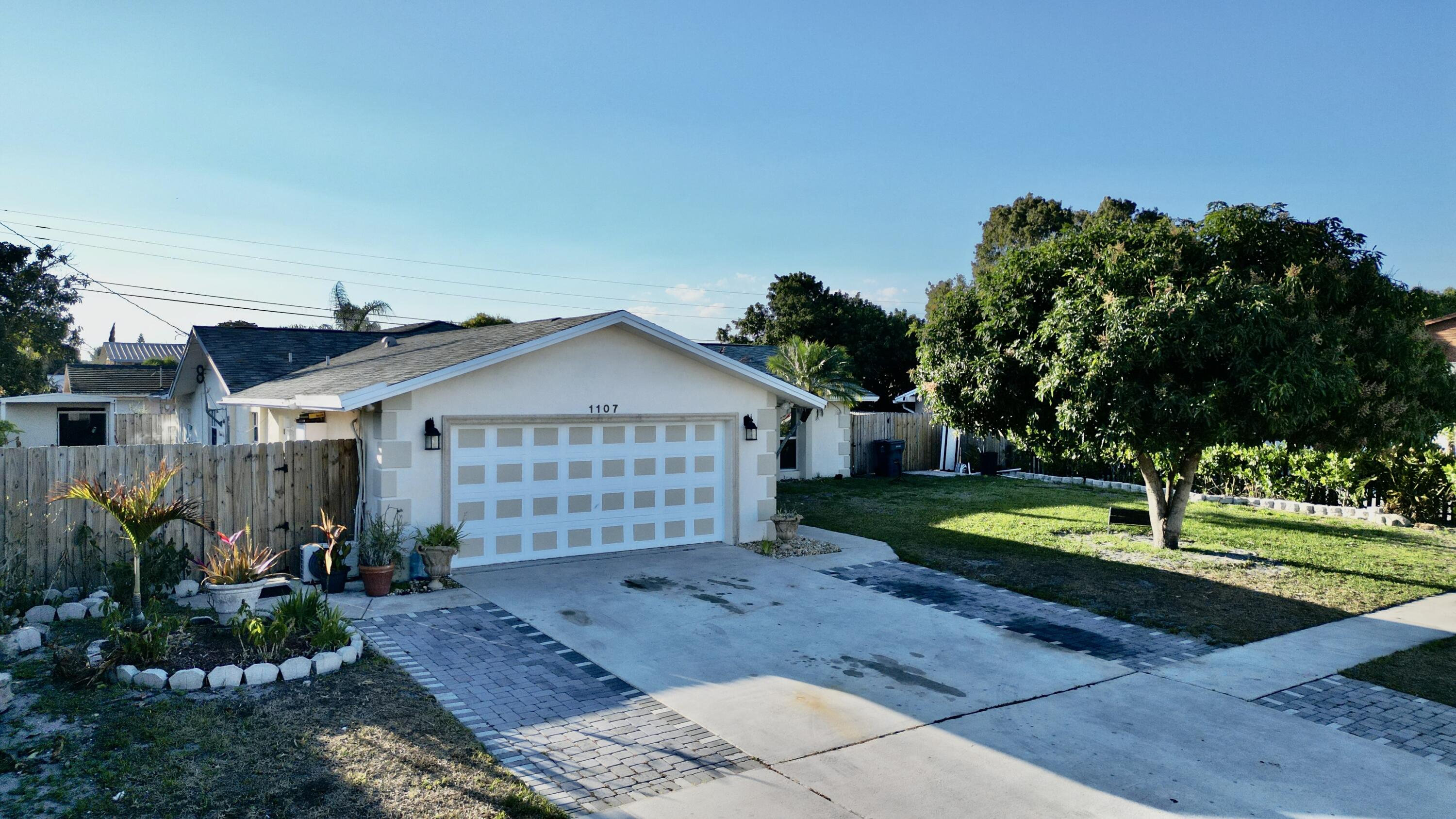 1107 Woodcrest Road West West Palm Beach, FL 33417 - Photo 2 of 64 1