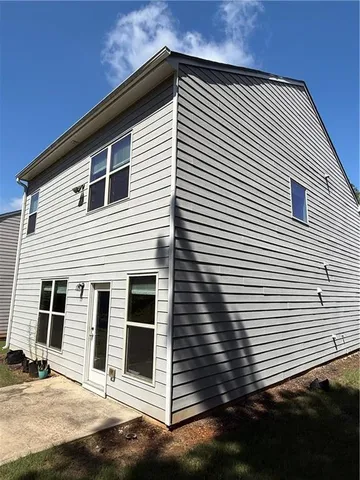 a view of a house with a street