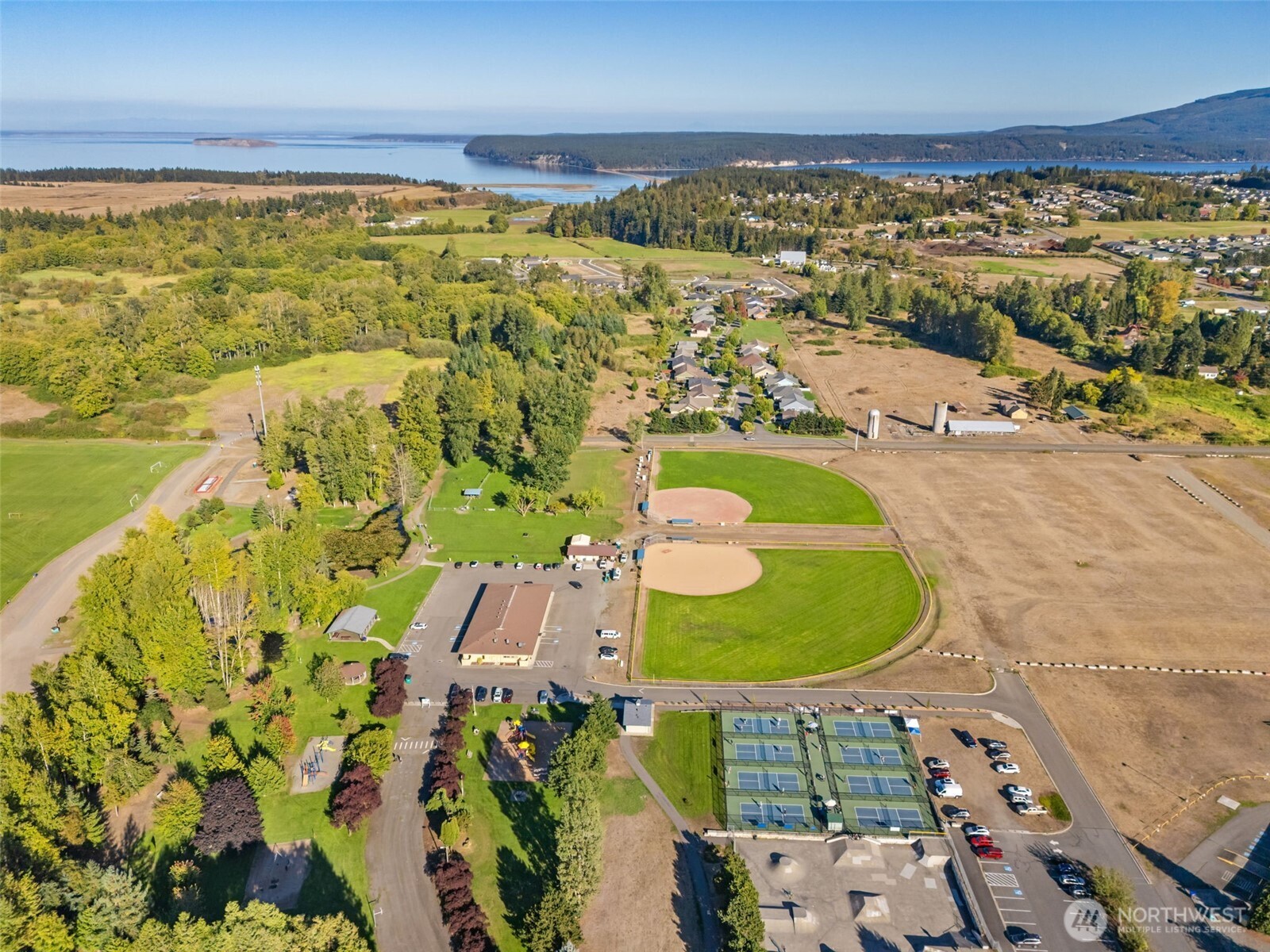 151 Dover Lane Sequim, WA 98382 - Photo 17 of 25 an aerial view of a swimming pool with a yard