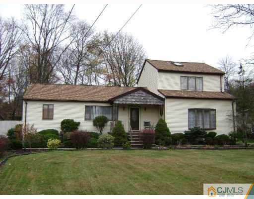 751 New Dover Road Edison, NJ 08820 - Photo 1 of 10 a view of a house with a yard and potted plants