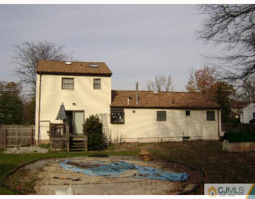 751 New Dover Road Edison, NJ 08820 - Photo 2 of 10 a view of a white house with a yard and plants